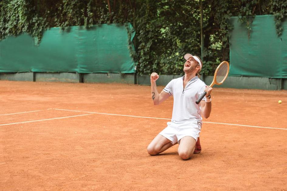 stock-photo-blond-winner-racket-celebrating-kneeling.jpg
